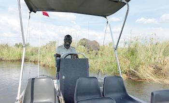 Our Camp Okavango guide on a boat ride through the delta — Botswana.