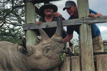 Marie and Carl feeding a blind rhino at the Ol Pejeta Conservancy.