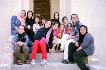 Group of kids on steps at Dowlat Abad Garden — Yazd, central Iran. Photo by Arlene Mikkelsen