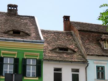 Many of the houses in Sibiu have eyebrow dormers, which add light and ventilation to the attics.