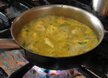 Cooking the chicken curry.