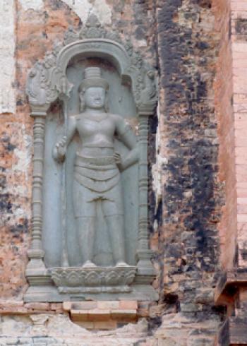 A dvarapala, or male guardian, on one of the temples of the Preah Ko complex — Cambodia. Photos by Julie Skurdenis