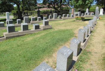 Two rows of grave markers converge to form what looks like the bow of a ship at Fairview Lawn Cemetery — Halifax.
