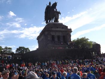 The opening ceremony for the 15th IVV Olympiad took place near a large statue of German Emperor William I at Deutsches Eck in Koblenz.