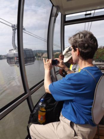 Karen Heady riding a cable car across the Rhine River in Koblenz.