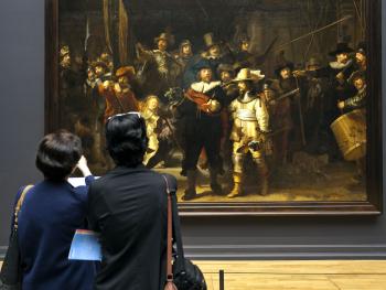 Learning the stories behind Europe’s great art, such as Rembrandt’s “Night Watch,” is a people-to-people experience. Photo by Dominic Arizona Bonuccelli
