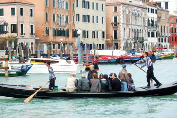 In Venice, only three traghetti (shuttle gondolas) still ferry voyagers across the Grand Canal from established stops, though you can always rent a gondola for your own private ride. Photo by Rick Steves