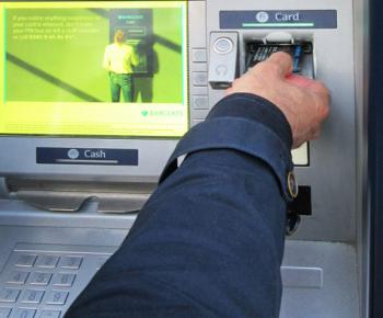 ATMs are frequent targets for travel scams in Europe. Whether anyone's around or not, cover the keypad when entering your PIN. Photo by Tom Griffin