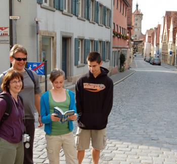 Let your teens lead the way sometimes, like this young traveler in Rothenburg, Germany. Photo by Rick Steves 