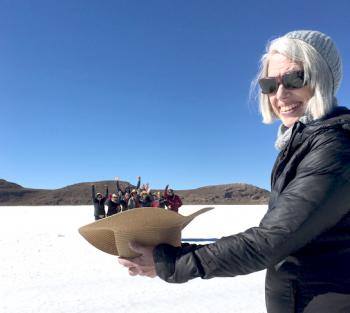 A member of our tour group “holding” the rest of us in her hat at Salar de Uyuni.