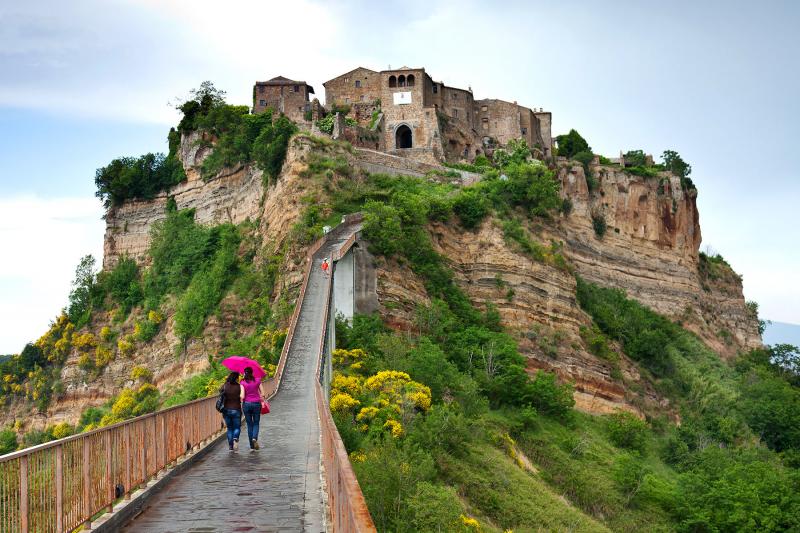A footpath is all that connects Italy’s Civita di Bagnoregio to the “mainland.” Photo by Dominic Arizona Bonuccelli