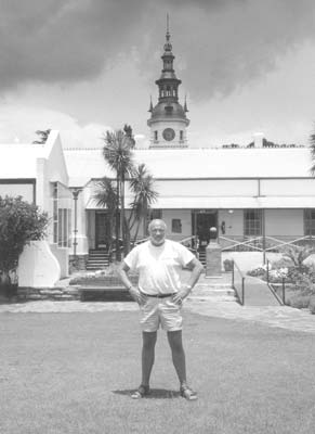Vern Lewis stands outside Paul Kruger’s home in Pretoria, South Africa.