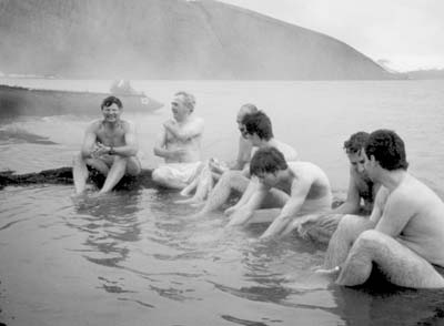 Randy (far left) and fellow passengers “enjoy” the beach hot springs on Deception Island.