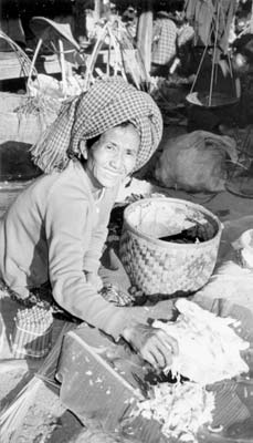 Seller at Khaung Taing market — Inle Lake.
