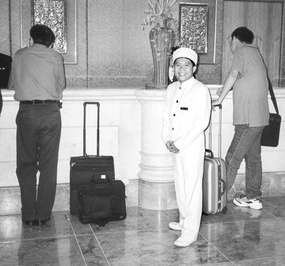 This bellboy stands ready to assist guests at the Makati Shangri-La.