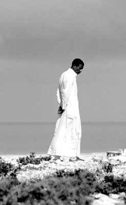 Lone man standing against the Mediterranean Sea near El-Alamein, Egypt.