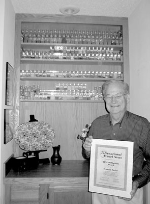 Truman Taylor with his collection of soil and rock samples and his ITN 100 Nations Award.