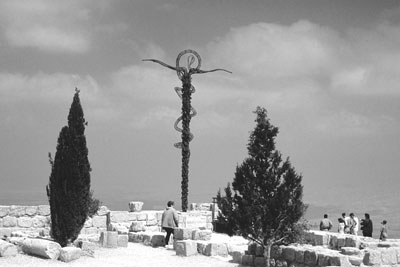 At cliff’s edge atop Mount Nebo, this cross in the form of a serpent stands behind the church.