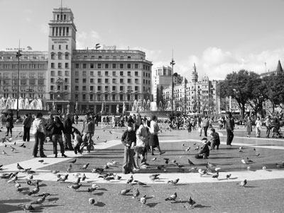 Placa de Catalunya, the big square at the top of Las Ramblas in Barcelona, divides old and new Barcelona and is about a half-hour walk from the waterfront.   