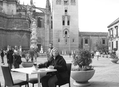Judy pauses for a glass of wine and a plate of olives on the plaza adjacent to the Giralda bell tower in Seville.