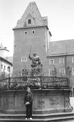 Carol in front of the Fountain of Justice in Haidplatz.