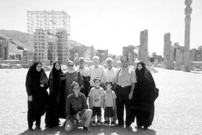 Betty and Dick Podol pose with an extended family they met in Shiraz and saw again here, in Persepolis.