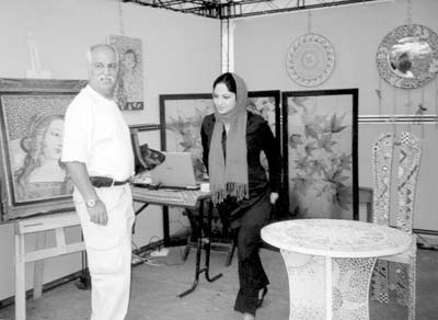 Young artist and a display of her work at the Shah’s Palace. Also pictured is the Podols’ guide, Siavash Amirsharafi of Pasargad Tours. 