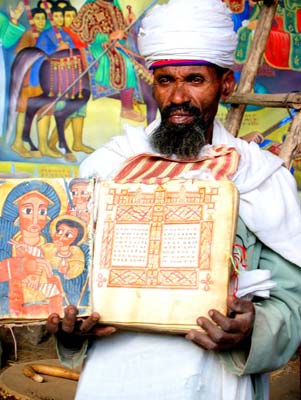 Priest displaying a vellum bible at the St. Mary of Zion church in Axum.