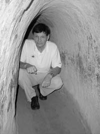 Randy Keck inside the entrance enlarged for tourists at the Cu Chi Tunnels in the Iron Triangle. 
