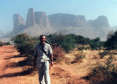 Jim Sill on the road to Timbuktu with the outcropping Fatima’s Hand in the background.