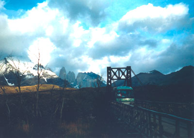 Crossing the narrow bridge in Torres de Paine National Park, with the torres (towers) in the background.  Photos: Burke