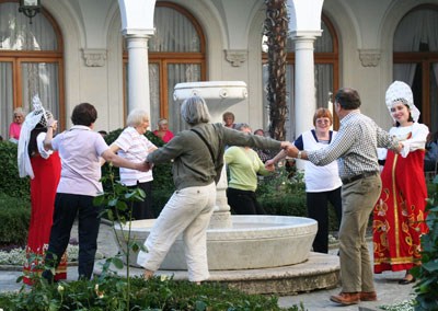 Discovery passengers and local musicians dance in the courtyard at the Livadia Palace. The historic final photos of the 1945 Yalta Conference were taken right in front of the fountain. 
