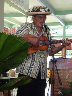 A man sings as we await our departure from the Rarotonga Airport. Photo by Corrine Slade