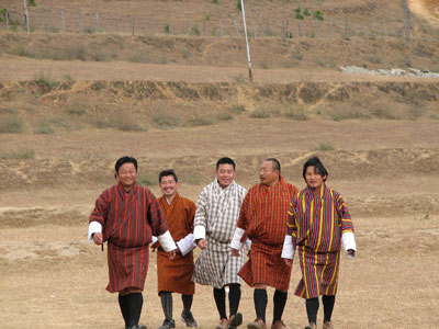 Bhutanese men wearing the gho, their national dress.