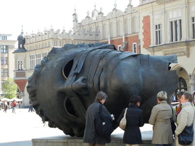 “Eros Bendato” (“Eros Bound”), a sculpture by Igor Mitoraj, on display in Kraków’s Old Town Square.