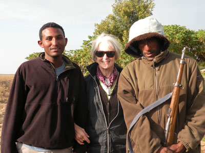 Rita with our local guide and a guard in the Simien Mountains.