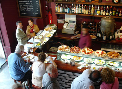 Tempting plates in Spain’s tapas bars make it easy to sample new foods. Photo: Rick Steves