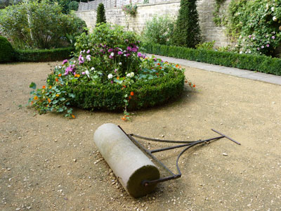 A roller was used on the gravel-and-clay surface in the Georgian Garden.