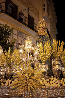 In Spain’s Andalucia, religious floats commonly parade through town. Photo by Dominic Bonuccelli