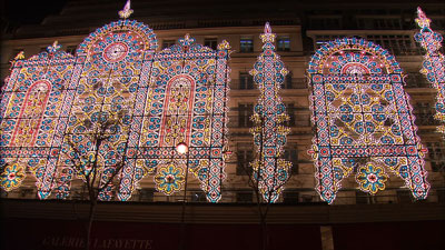 The facade of Galeries Lafayette — a major Paris department store — is decorated with thousands of lights at Christmastime.