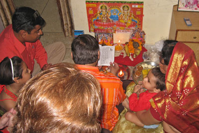 Performing Lakshmi Puja during Diwali, a family thanked the goddess Lakshmi for her blessings — Jaipur. Photo by Wanda Bahde<br />
