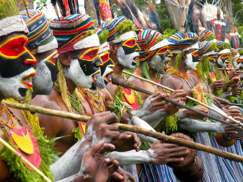 Tribesmen singing at the Tumbuna Sing-Sing in Papua New Guinea. Photosx by Larry Kritcher