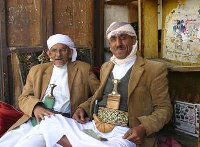 Yemeni men in Sana’a with traditional curved daggers. Photo by Al Podell