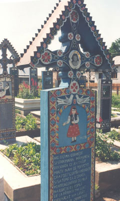 A painted grave marker in the Merry Cemetery — Sapânta, Romania. Photo: McCombs