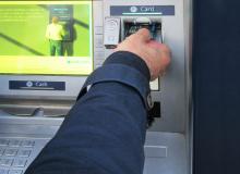 ATMs are a frequent target for travel scams in Europe — if anyone’s around, cover the keypad when entering your PIN. Photo by Tom Griffin
