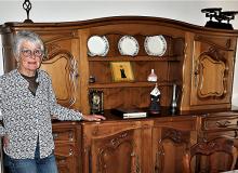 Estelle Alcaraz by an heirloom credenza at the farmhouse in Pernes-lesFontaines. Photos by Victor Block