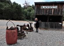Fyllis Block inspecting blacksmith shop hardware at the Coarsegold Historic Museum in Coarsegold, California. Photos by Victor Block