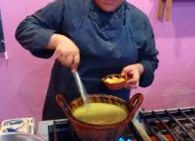 Chef/instructor Ruth Ruiz cooking in a traditional clay pot.