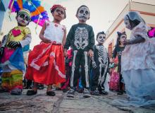 Children pausing during a parade through the streets of Oaxaca.