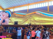 The gold-plated Reclining Buddha is 33 meters loåçng — Penang. Photo by Robert Siebert